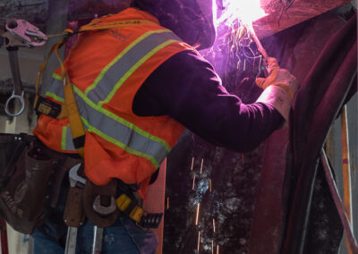 construction jobsite photo, iron worker welding at a commercial construction project San Francisco